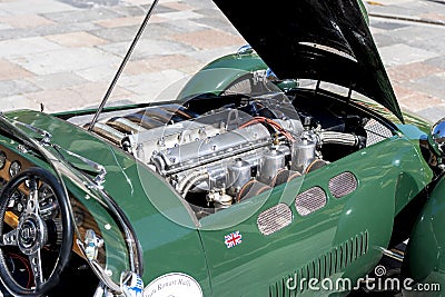 Jaguar retro vintage sports car engine close up. Restored motor of green antique automobile Editorial Stock Photo