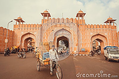 Driving people past Ajmer gate of historical city wall and moving vehicles of Rajasthan Editorial Stock Photo