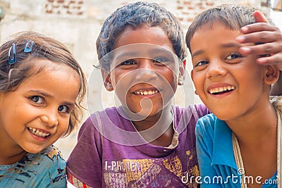 Jaipur, India - September 20, 2017: Portrait of beautiful group of children, smiling and playing in the street in Jaipur Editorial Stock Photo