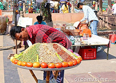 Man selling spices nuts and vegetables Editorial Stock Photo