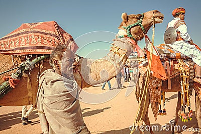 Camel rider in caravan of the outdoor Desert Festival of Rajasthan Editorial Stock Photo