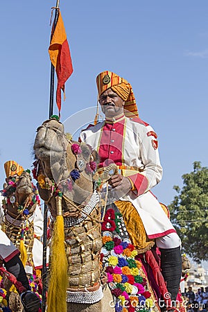 Camel and indian men wearing traditional Rajasthani dress participate in Mr. Desert contest as part of Desert Festival in Jaisalme Editorial Stock Photo