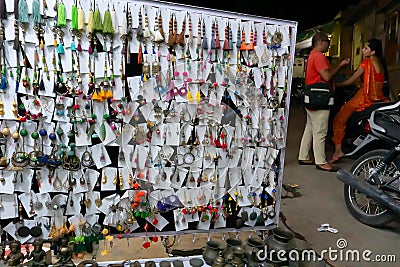 Various shapes and shades of earrings , handicrafts on display for sale Editorial Stock Photo