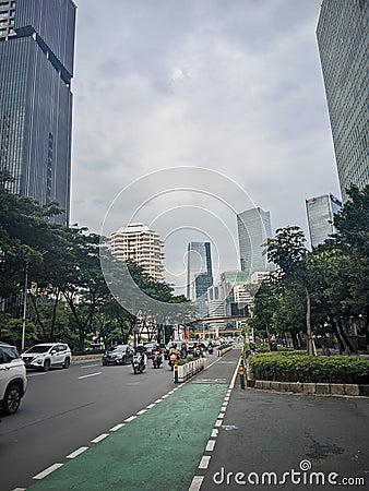 Jakarta city highway which is still cool with lots of trees on the sides Editorial Stock Photo