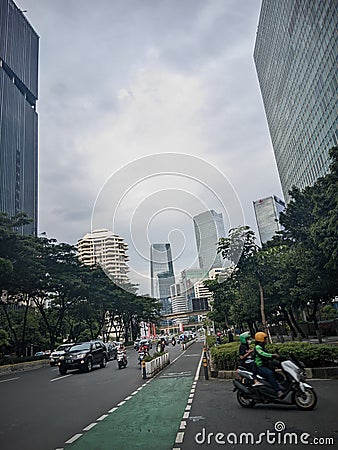 Jakarta city highway which is still cool with lots of trees on the sides Editorial Stock Photo