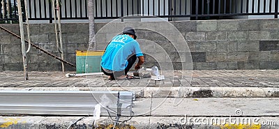 Workers who are welding aluminum to be used as a frame. Editorial Stock Photo