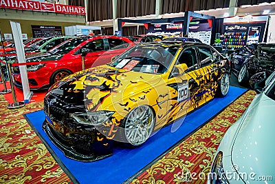 Modified black and yellow BMW 320i F30 in IAM automodified jakarta 2023 Editorial Stock Photo