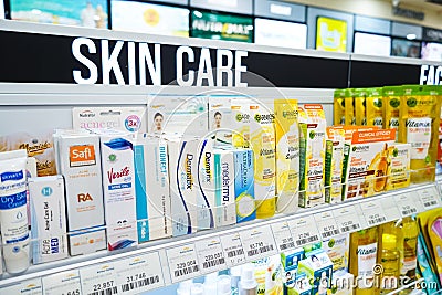 Jakarta, Indonesia, february 16, 2022: Skin care and cosmetics products displayed on shelves in department store. Skin care and Editorial Stock Photo