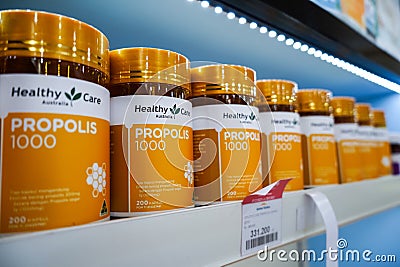 Jakarta, Indonesia, february 16, 2022: Various types of vitamins and supplements, propolis on the pharmacy shelf. Drugstore and Editorial Stock Photo