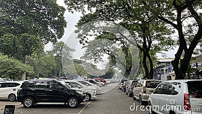 Rows of visitors' cars in the parking area of Ragunan Zoo Editorial Stock Photo