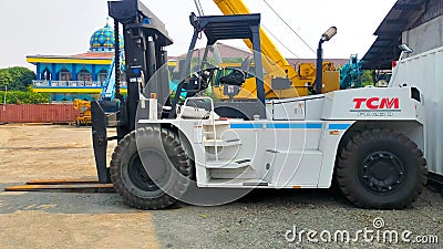 Jakarta, Indonesia - July 18, 2022: Side view large 23 Tons FD230 capacity TCM forklift parking at the yard Editorial Stock Photo