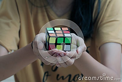 hand holding a Rubik's cube. Editorial Stock Photo