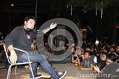 JAKARTA, INDONESIA ; The lead singer of the band Pee Wee Gaskin indonesiawas singing in front of the audience. Editorial Stock Photo