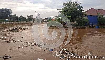 Jakarta, Jakarta / Indonesia - January 1th 2020: rubbish carried by flood water flow Editorial Stock Photo