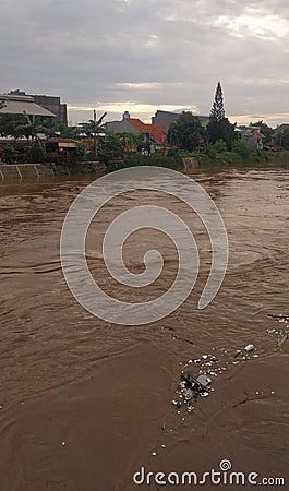 Jakarta, Jakarta / Indonesia - January 1th 2020: rubbish carried by flood water flow Editorial Stock Photo