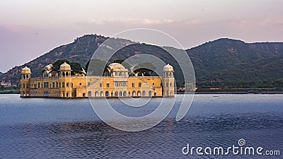 Jal Mahal At jaipur amid Lake Water and mountain backdrop. Left Stock Photo