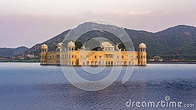 Jal Mahal At jaipur amid Lake Water and mountain backdrop. Right Side Stock Photo
