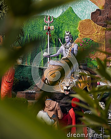 Jalandhar, Punjab, India -January, 2023 Lord Shiv statue at a temple in jalandhar, Punjab, India with blur foreground Editorial Stock Photo