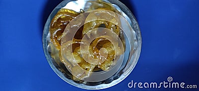 Jalebi Indian sweet with blue background Stock Photo