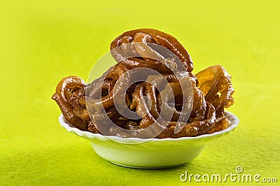 Jalebi Indian sweet dish on green background Stock Photo