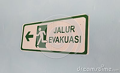 jalur evakuasi (Evacuation Route) sign in green color Stock Photo