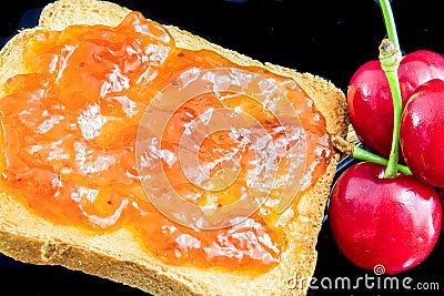 Jam, cherries and bread Stock Photo