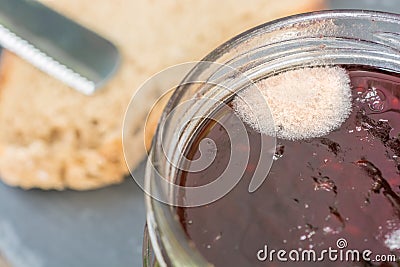 Mold on jam as a symbol of expired food Stock Photo