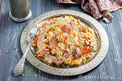 Jambalaya. Spicy rice with smoked sausage and red pepper Stock Photo