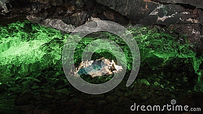 Jameos del Agua in Lanzarote, cave of volcanic origin illuminated with green light and a lake inside Stock Photo