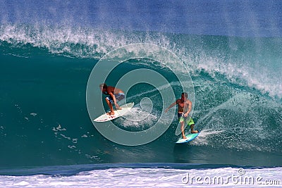 Jamie O'brien and Kalani Chapman Surfing a Wave Editorial Stock Photo