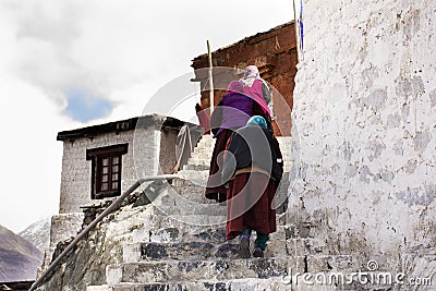 Tibetan pilgrim people walk on stone stairs step up approach to Diskit Monastery Galdan Tashi Chuling Gompa at Leh Ladak Editorial Stock Photo