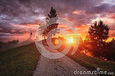 Jamnik church St Primus and Felician at sunrise, Slovenia, amazing landscape, dramatic sunrise Stock Photo