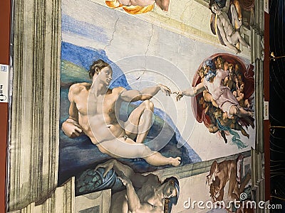 Close-up photo of the Creation of Adam from the Book of Genesis ceiling fresco painting by Michelangelo Editorial Stock Photo