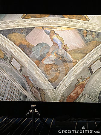 Close-up photo of David and Goliath ceiling fresco painting by Michelangelo in the Sistine Chapel Editorial Stock Photo