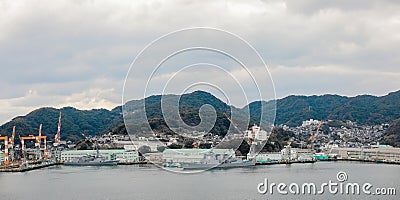 15 jan 2020 - Nagasaki, Kyushu, Japan : Warship parking next to Mitsubishi Heavy Industries, Nagasaki, Kyushu, Japan Editorial Stock Photo