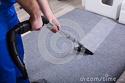 Janitor Cleaning Carpet Stock Photo