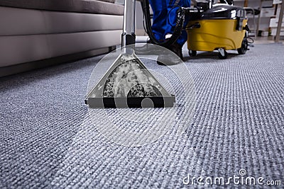 Janitor Cleaning Carpet Stock Photo