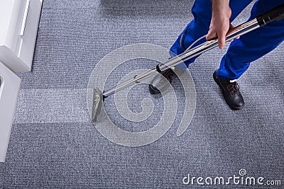 Janitor Cleaning Carpet Stock Photo