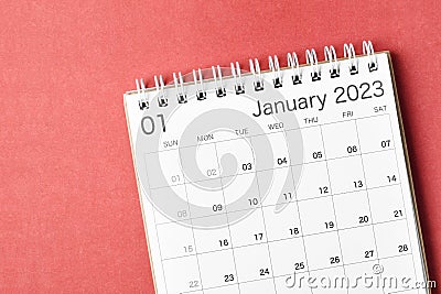 A January 2023 calendar desk for the organizer to plan and reminder isolated on red background Stock Photo