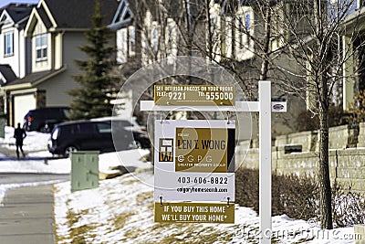 January 30 2021 - Calgary, Albeta - Canada real estate sign to sell house Editorial Stock Photo