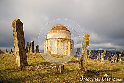 January gloomy day at an old Muslim cemetery. Eddie Gumbez mausoleum complex. Shamakhi, Azerbaijan Stock Photo