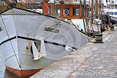 January 28 2023 - Greifswald, Germany: The harbor with wooden sailboats in historic city of Greifswald Editorial Stock Photo