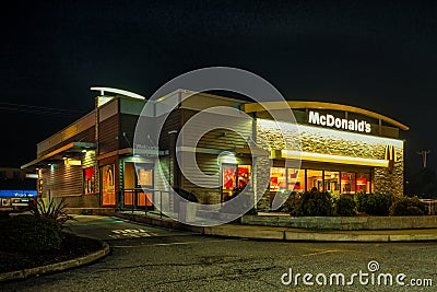 McDonald`s Restaurant in Coos Bay, Oregon at night. Editorial Stock Photo