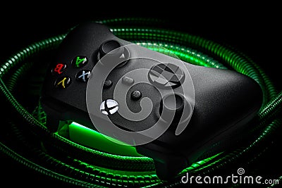 January 15, 2023, Odessa, Ukraine. A black Xbox Wireless Controller highlighted in green and red. Compatible Xbox Series X S, Xbox Editorial Stock Photo