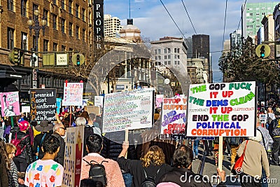 January 19, 2019 San Francisco / CA / USA - Participants to the Women`s March event hold signs with various messages Editorial Stock Photo