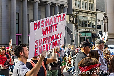 January 19, 2019 San Francisco / CA / USA - Women`s March `Dismantle White Supremacy` sign Editorial Stock Photo