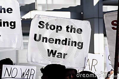 January 4, 2020 San Jose / CA / USA - Close up of Stop the Unending War sign raised at the anti-war protest in front of the City Editorial Stock Photo