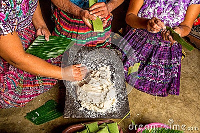 Mayan women preparing food called tamales in Guatemala Editorial Stock Photo