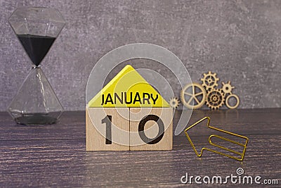 January 10th. Day 10 of january month, calendar on yellow background. Winter time. Stock Photo