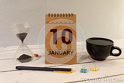 January 10th. Day 10 of january month, calendar on yellow background. Winter time. Stock Photo